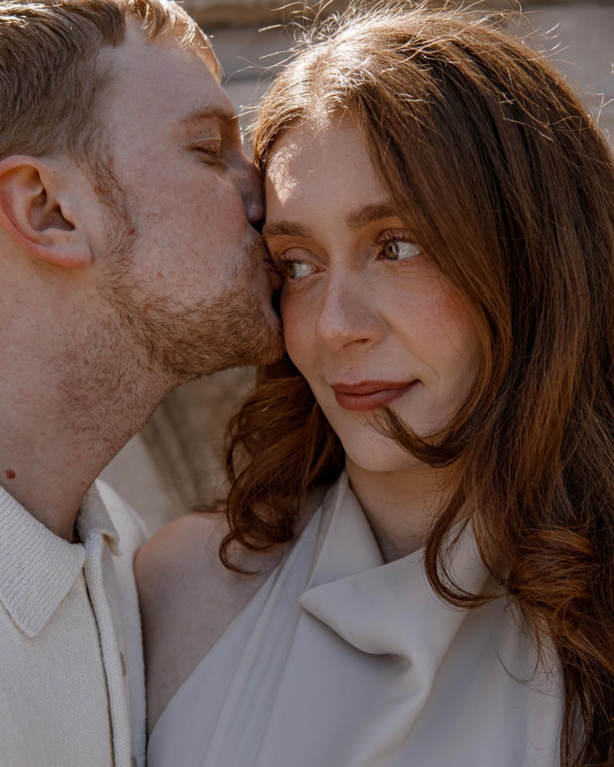 Cole kissing Maria on the cheek